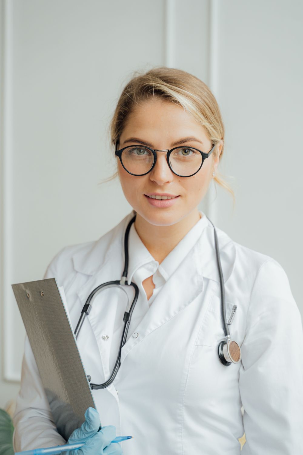 Portrait of Dr. Reem Al-Faisal, lead chiropractor at ALIGN